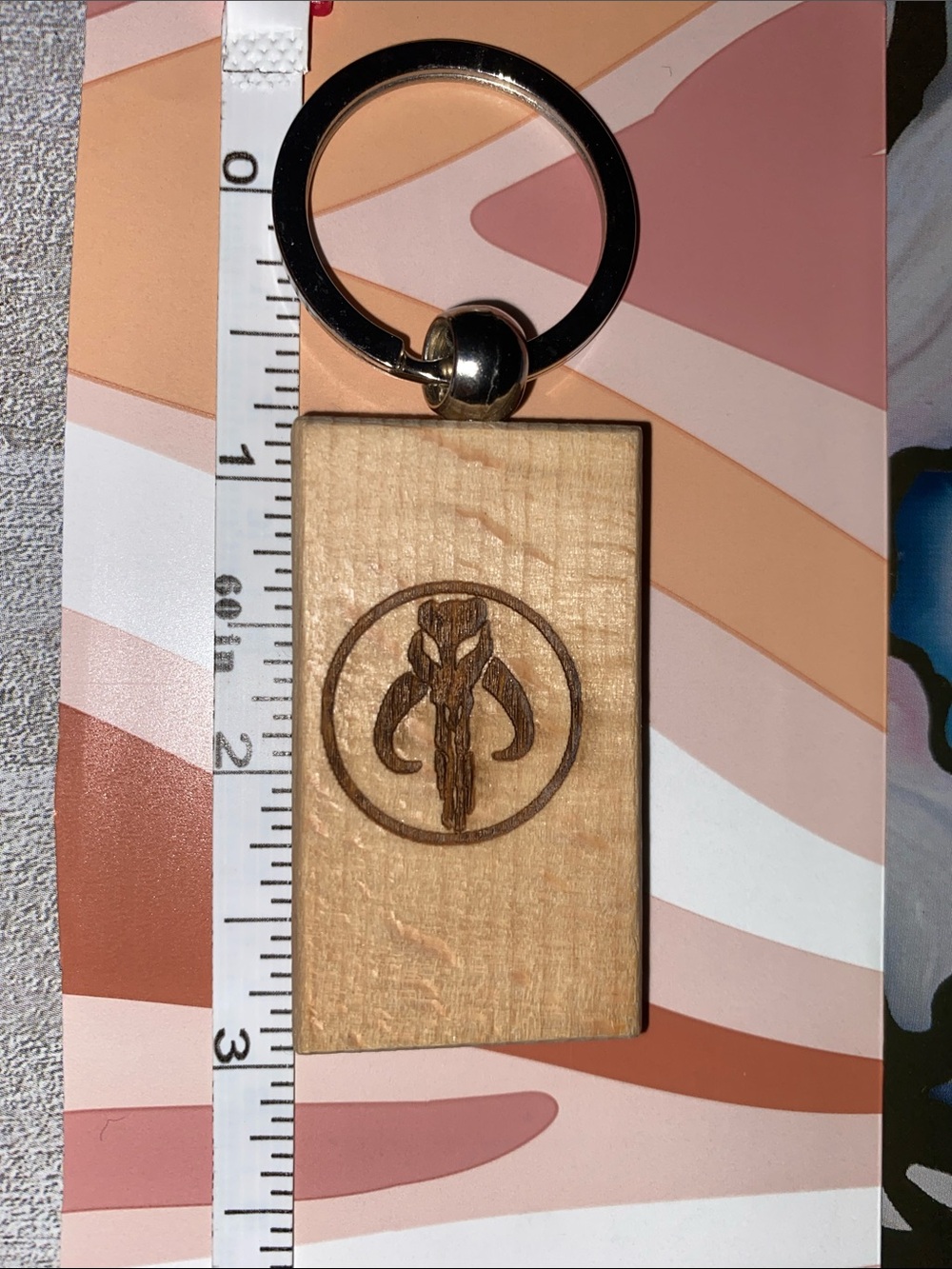 Wooden Keychain with Mandalorian Mythosaur Logo